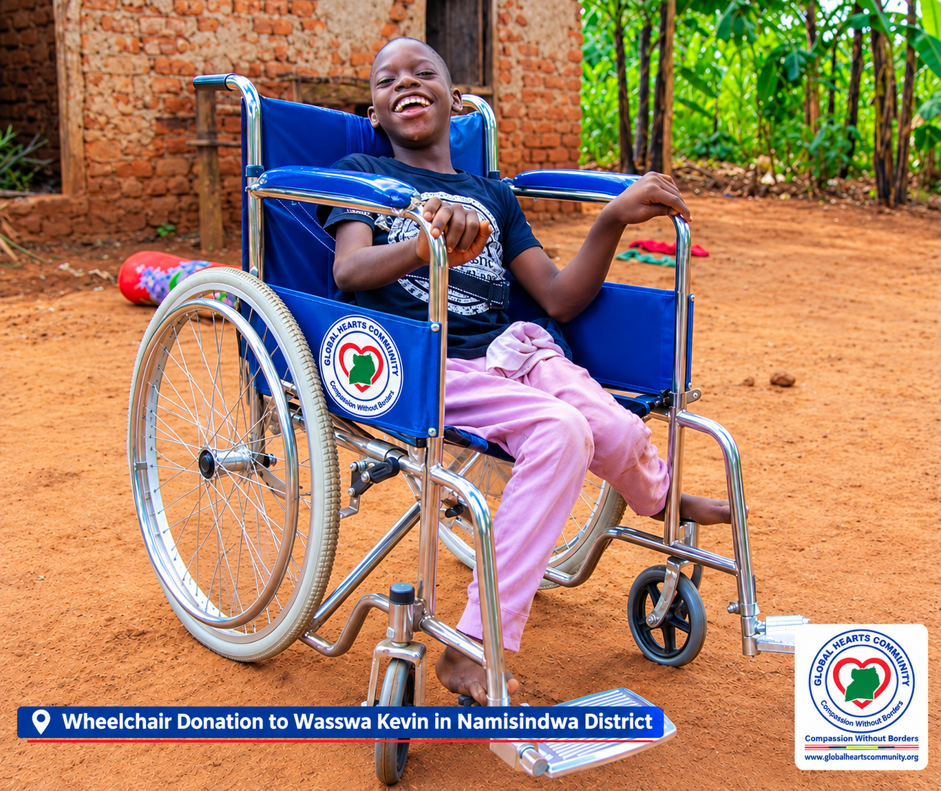 Wasswa Kevin in his new blue wheelchair in Namisindwa